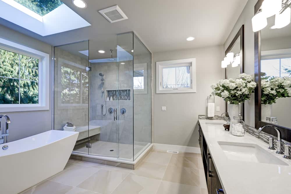 large white, beige, and gray bathroom wilt tile flooring, and bathroom fixtures