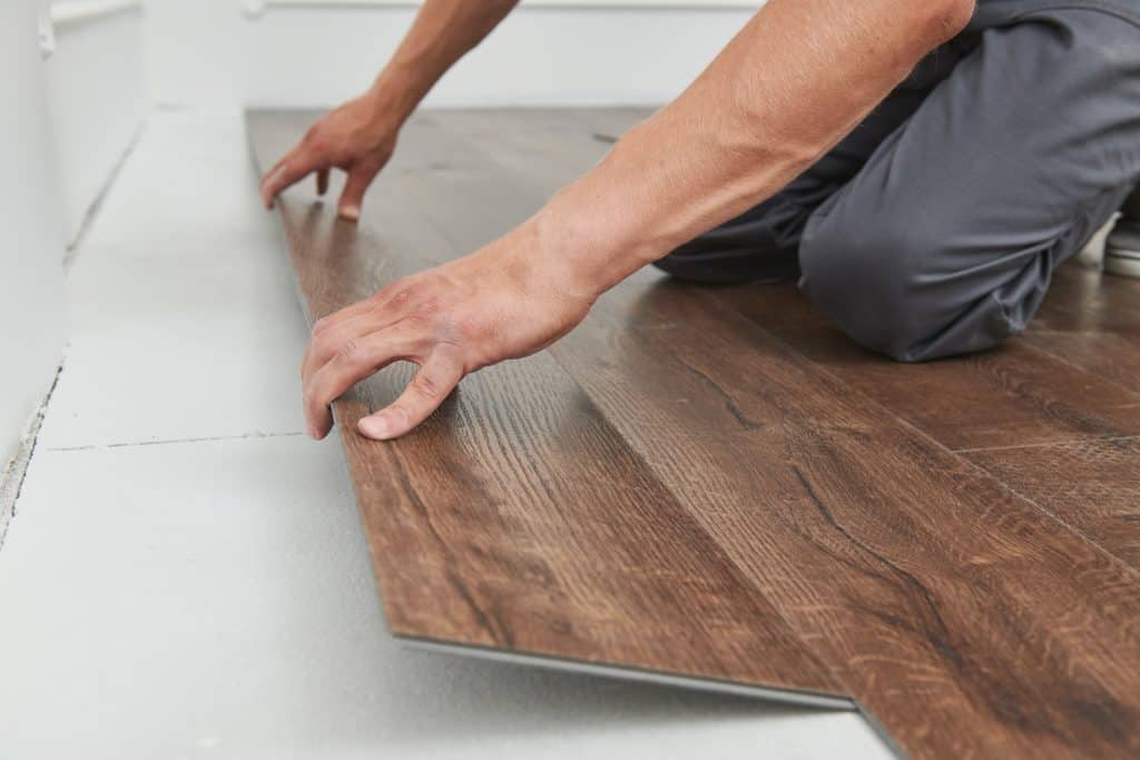 Man installing floor boards