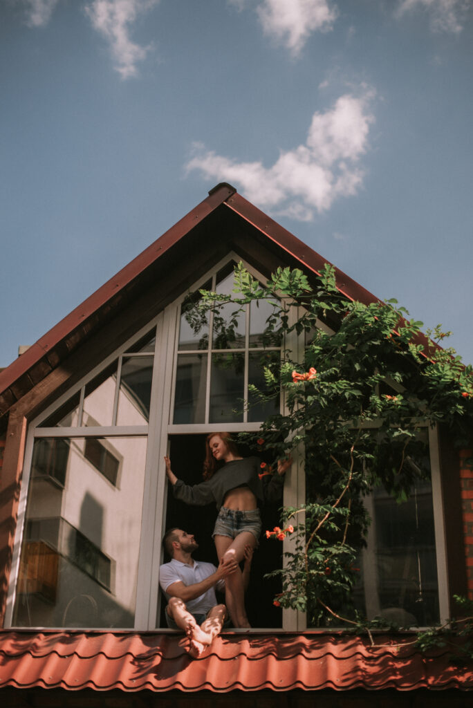 couple-hugging-wooden-house